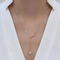 Rose gold necklace with a butterfly pendant on a white background