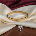 Paw Print Engraved Gold-Tone Bangle