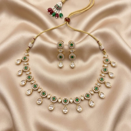 Jewelry set with necklace and earrings on a beige satin background