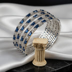 Shinayra by Nakhrali Creation set of 4 blue baguette and round CZ tennis bangles in rhodium silver finish.