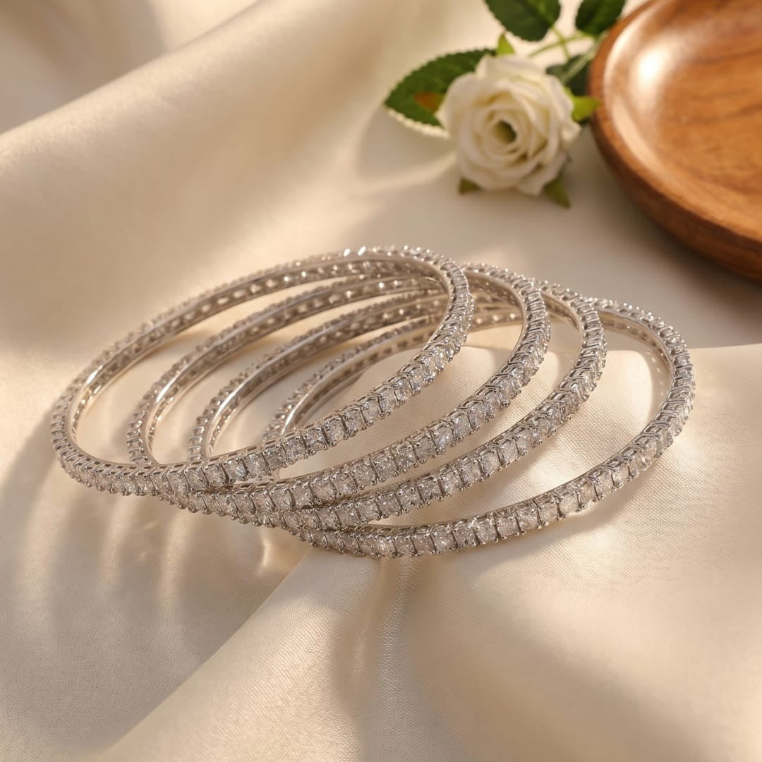Shinayra by Nakhrali Creation Emerald-Cut Zircon Bangle Set, a stack of 4 silver-tone bangles encrusted with channel-set emerald-cut zircons.