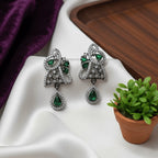 Shinayra by Nakhrali Creation emerald green CZ leaf pendant set with matching drop earrings in oxidised silver finish.