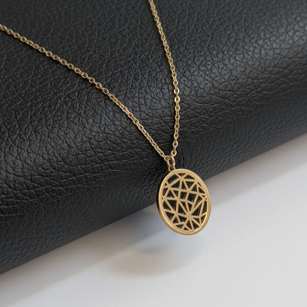 Shinayra by Nakhrali Creation gold-tone steel pendant chain with geometric mandala cutwork disc. Delicate cable chain, 18 inches.