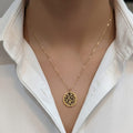 Shinayra by Nakhrali Creation gold-tone stainless steel pendant chain with geometric mandala cutwork disc.