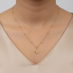 Shinayra by Nakhrali Creation gold-plated satellite bead chain with a micro-detailed butterfly pendant with CZ stone accents.