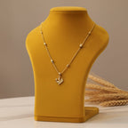 Shinayra by Nakhrali Creation gold-plated satellite bead chain with a micro butterfly pendant adorned with CZ stones.