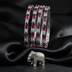 Shinayra by Nakhrali Creation ruby red baguette and round CZ tennis bangles set of 4, rhodium silver finish, bridal essential.